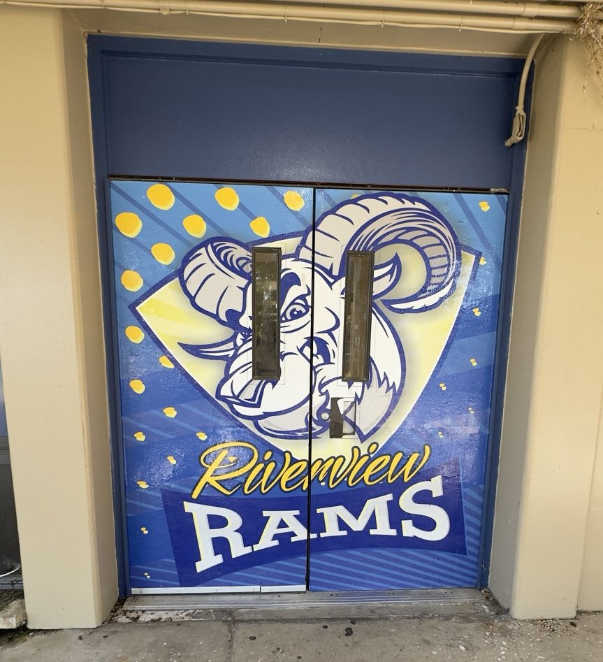 Riverview Rams entrance doors at Riverview Gardens High School in St. Louis, Missouri, during a Most Precious Dreams Foundation community outreach visit.